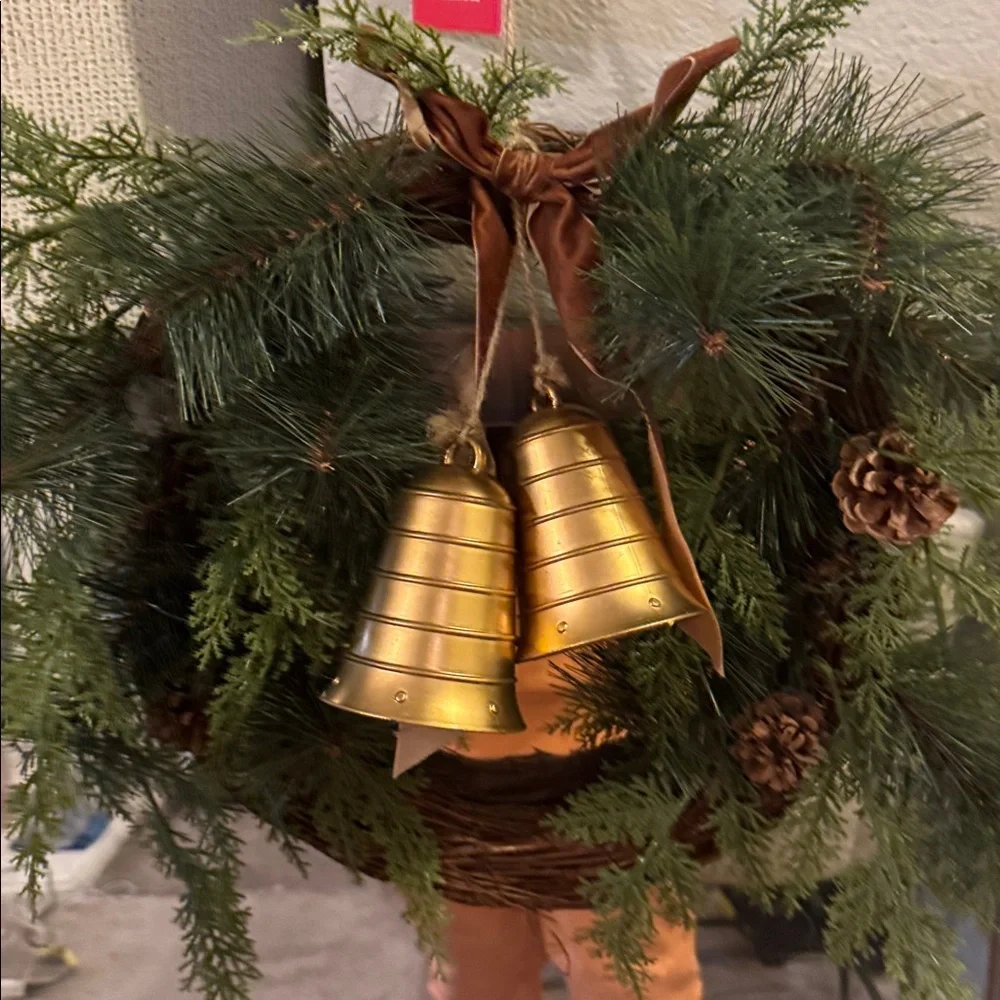 Elegant Holiday Wreath with Gold Bell and Brown Ribbon